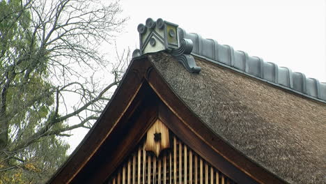 the tiled-roof peak of a hinoki bark roof on a japanese house