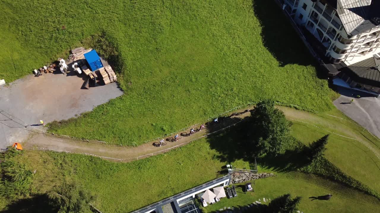 Aerial View of Mountain Bikers on a Green Trail