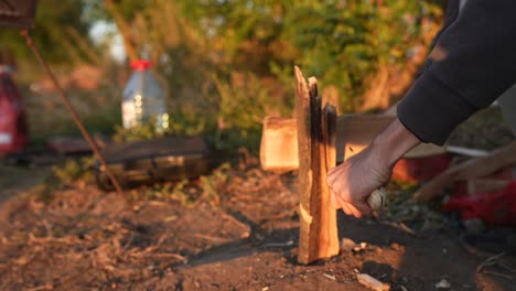 Preparing firewood for a campfire