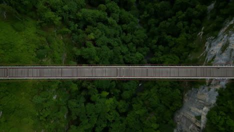 top down spiral drone shot of caille bridge and caquot bridge during the day in allonzier-la-caille cruseilles, haute-savoie, france