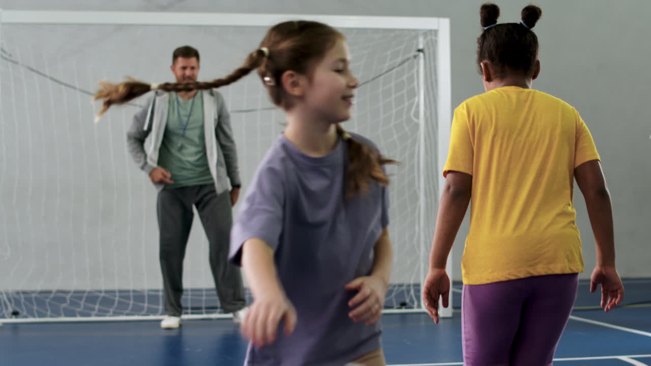 Kids kicking soccer ball