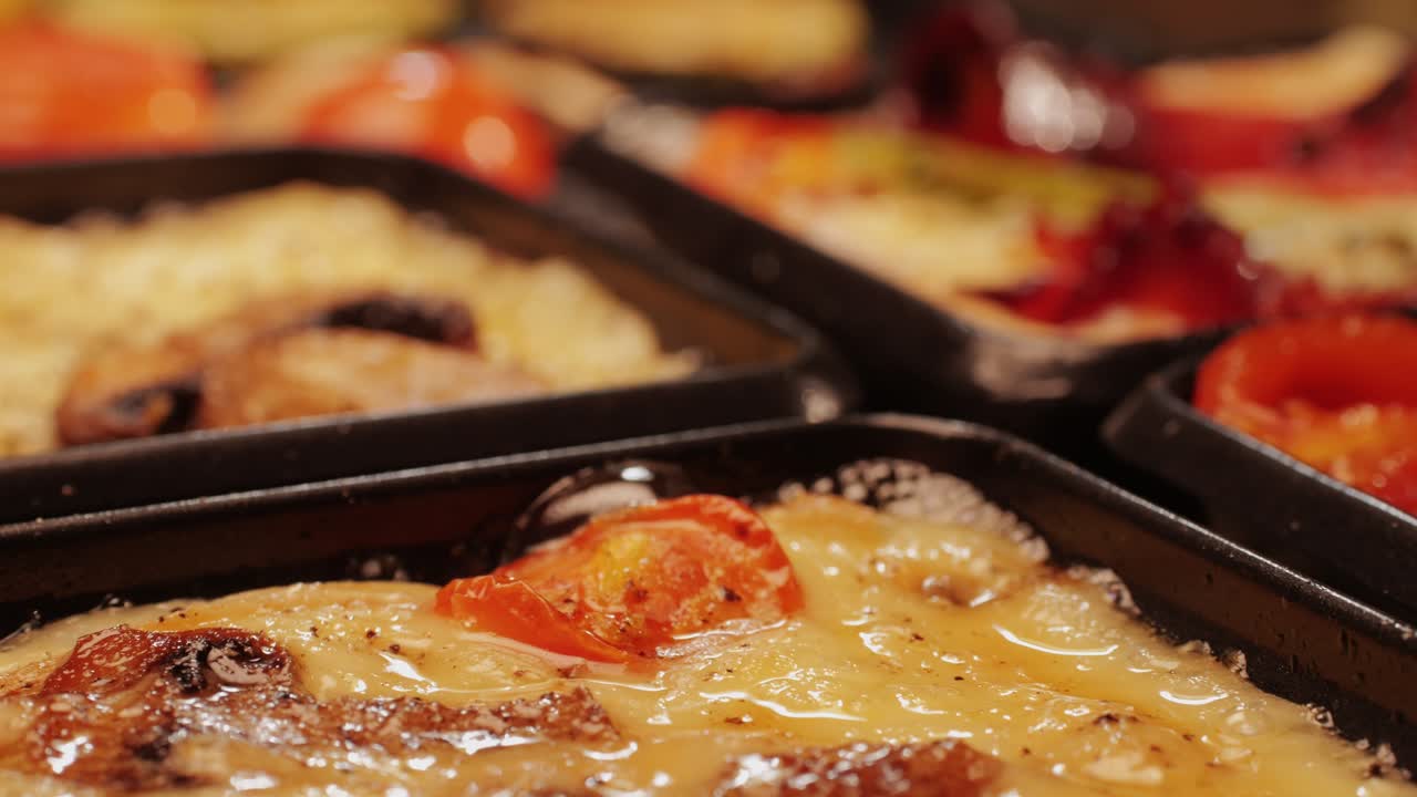 French Swiss or Spanish restaurant with traditional tapas food, Spanish cuisine, delicious tapas and cheese plate, bruschetta with cheese, olives dry tomatoes and tasty sandwich bar appetizer, buffet