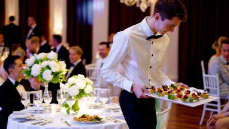 wedding reception with wait staff serving appetizers