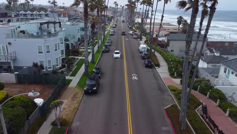 cars pass on oceanside strand