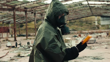 man with gas and geiger counter in nuclear site