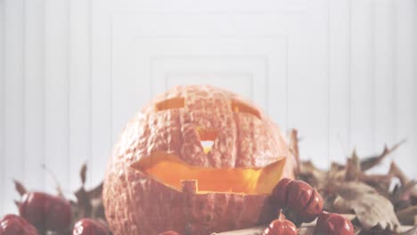 Digital-composition-of-halloween-scary-pumpkin-against-concentric-squares-on-white-background