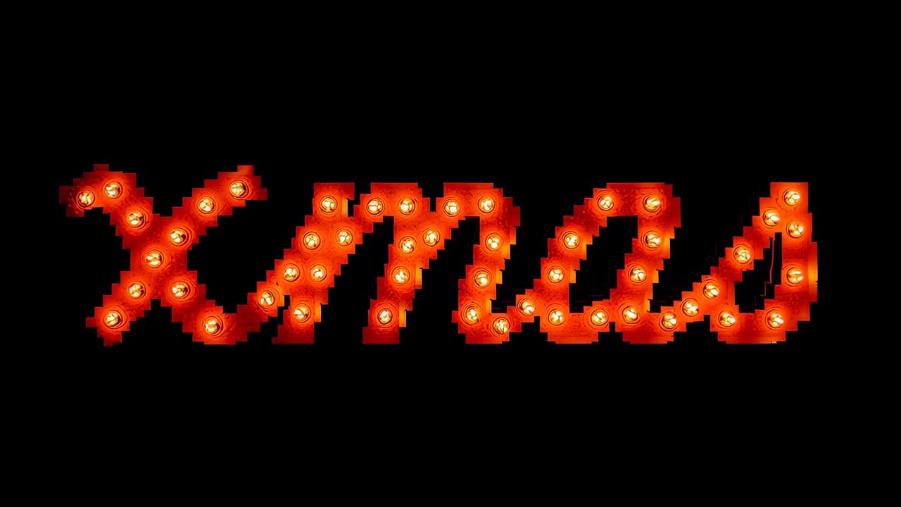 Opening clip showing marquee sign glowing in dark, bulbs subtly flickering 'Xmas' for holiday sign
