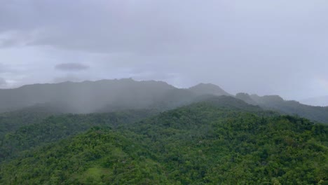 Aerial-hyperlapse-of-mist-blowing-over-the-forest