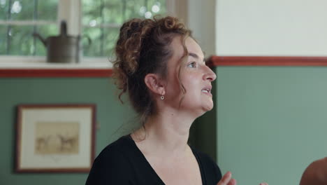 a woman with curly hair indoors