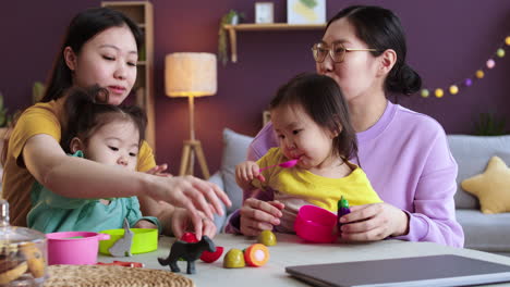 mothers and babies in living room