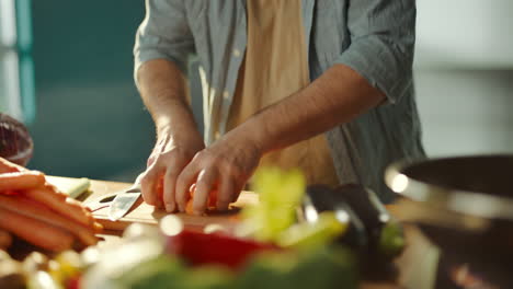 man cooking vegetables