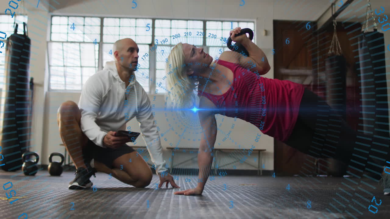 Exercising with kettlebell, woman observed by trainer with animation overlay