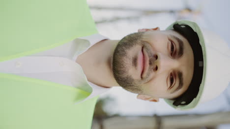 portrait of a male engineer or construction worker in a hard hat and safety vest