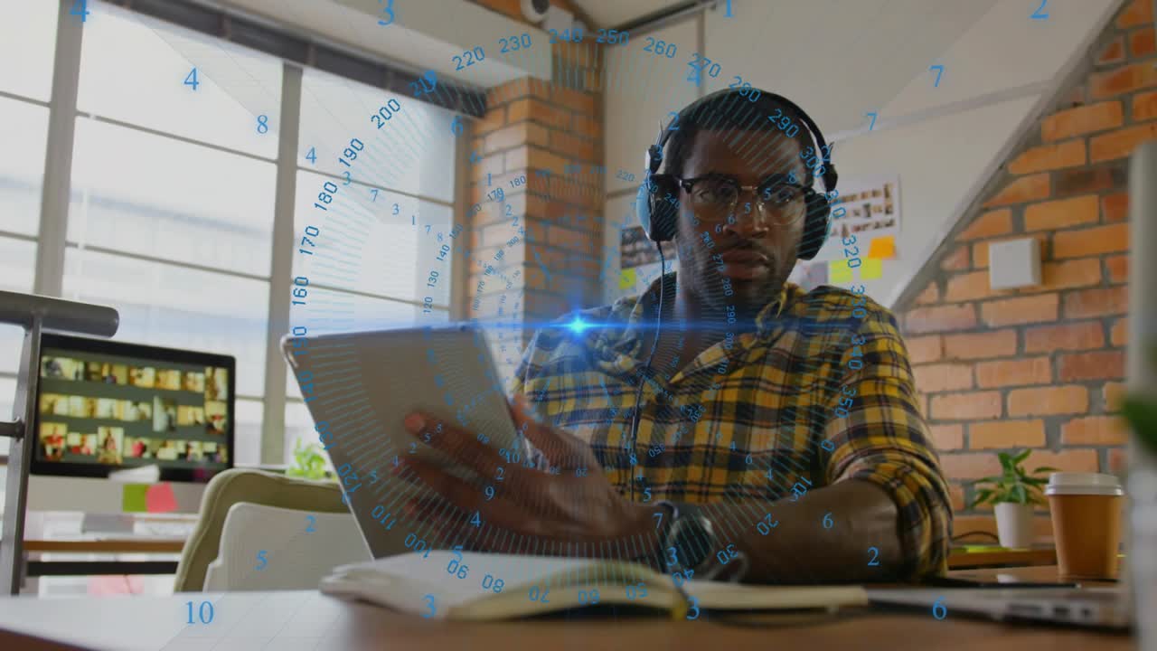Technology analyst lifting tablet and tapping screen in office analyzing data via rotating overlay