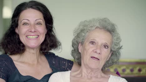 Daughter-and-mother-having-video-chat,-behaving-emotionally