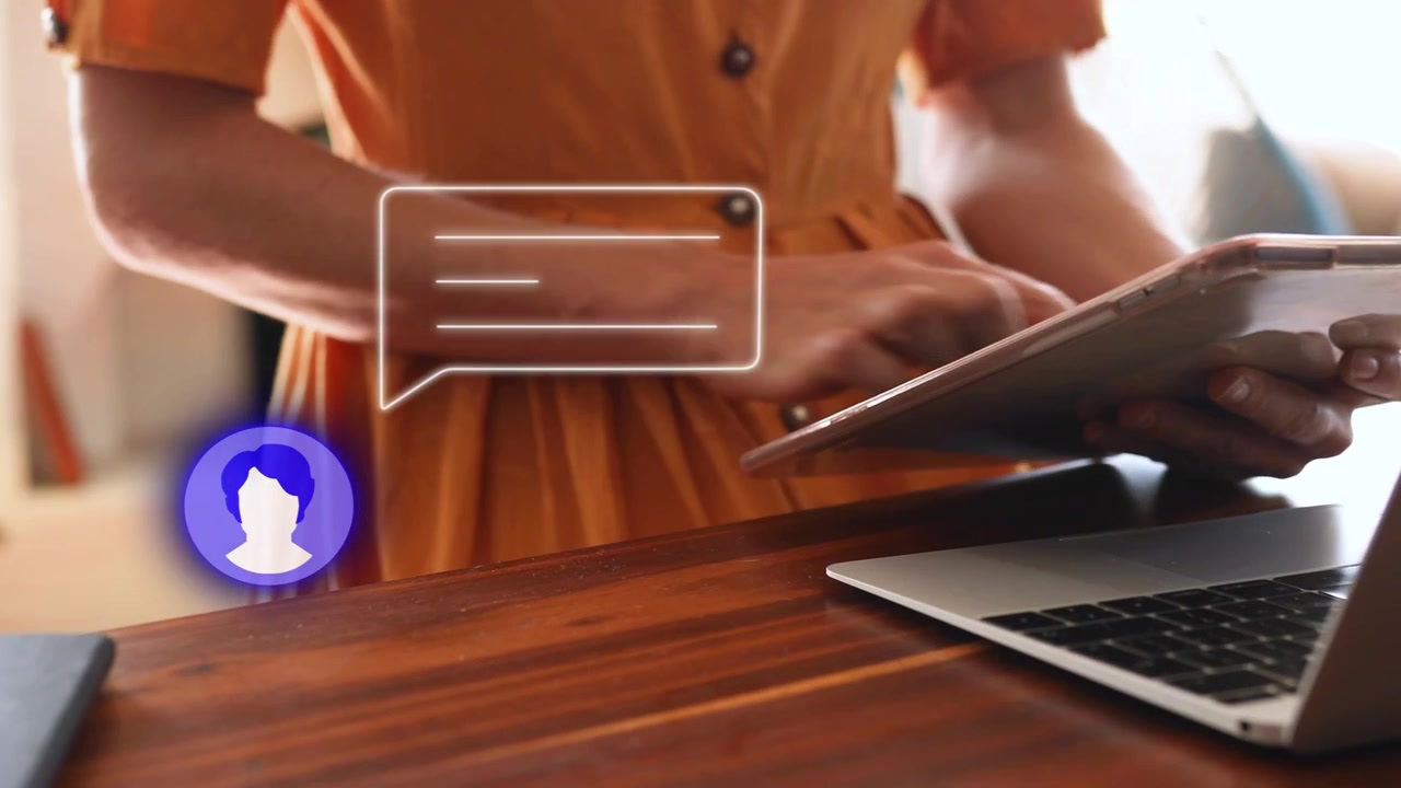 Woman typing on laptop, reacting to incoming tech chat bubble overlay and tapping tablet to reply