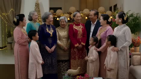 a joyous intergenerational family gathering in traditional attire