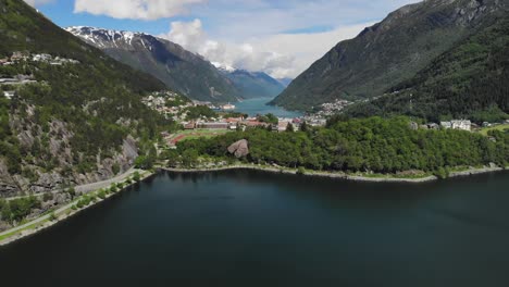 Aerial-pan-shot-of-a-beautiful-town-in-a-valley-during-summer