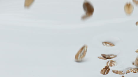 oat flakes falling yogurt in super slow motion close up. dietary healthy food.