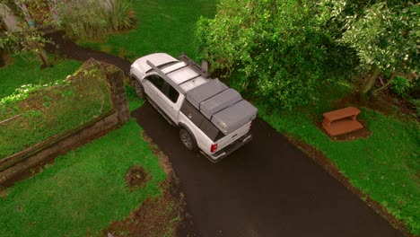 a panorama view of an off-road vehicle parked by a house in costa rica