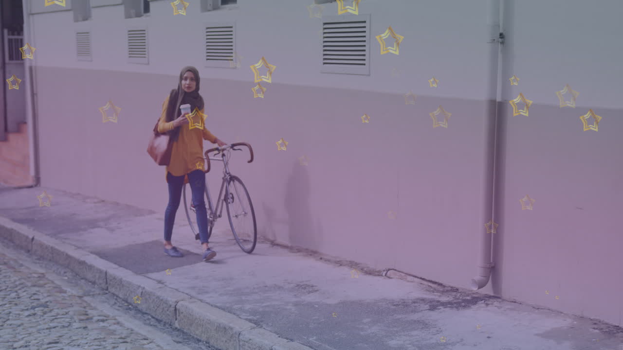Multiple golden star icons against woman in hijab with bicycle walking on the street