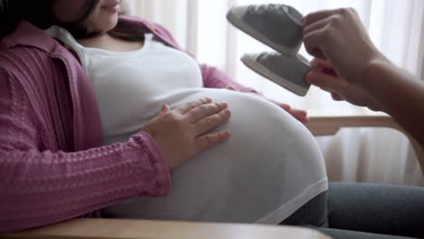 pregnant couple feels love and relax at home.