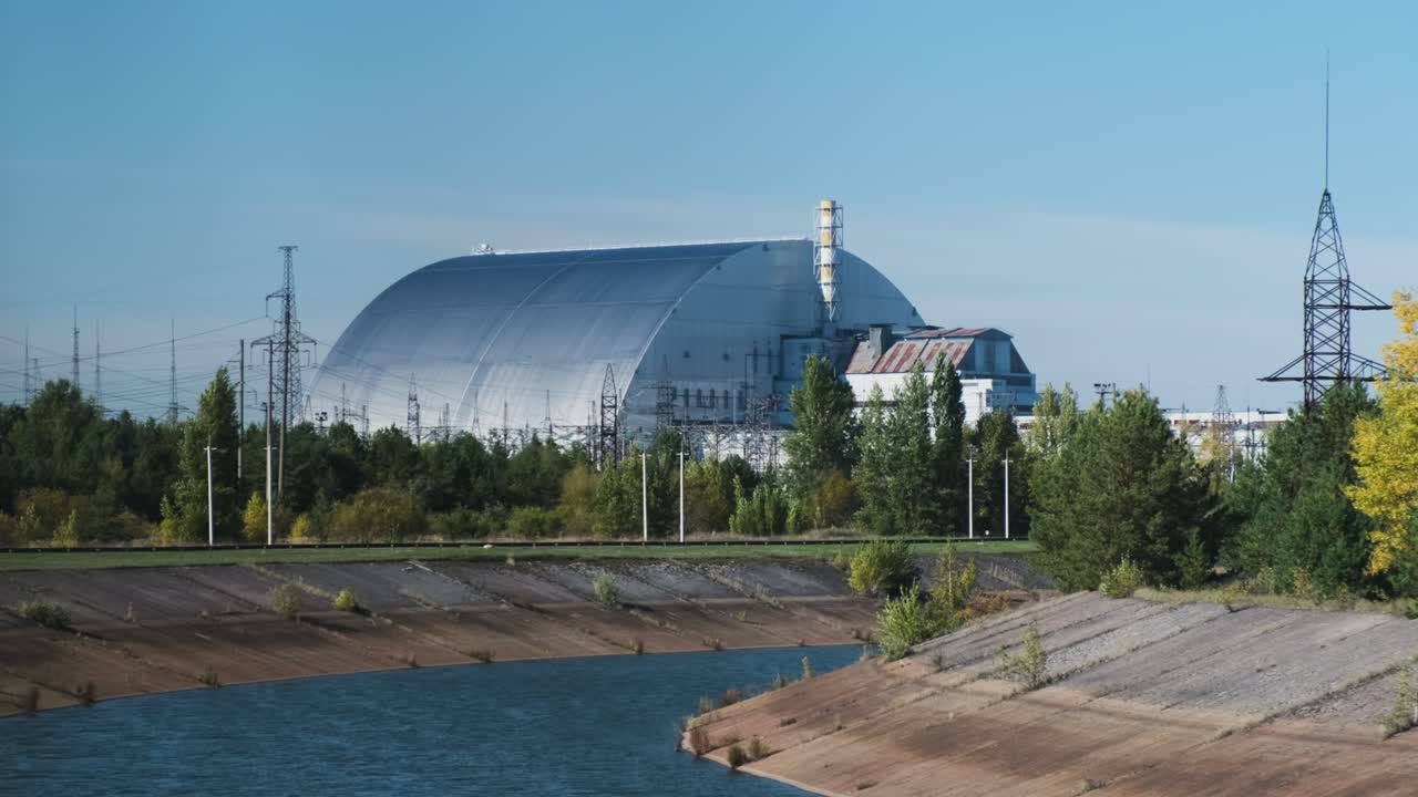 Sarcophagus Chernobyl, fourth reactor, shelter. Metal hangar, view from a moving bus on a tour