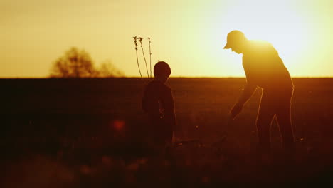 father and son planting a tree