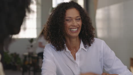 happy business women brainstorming friends working together enjoying conversation sharing creative ideas in relaxed office workplace