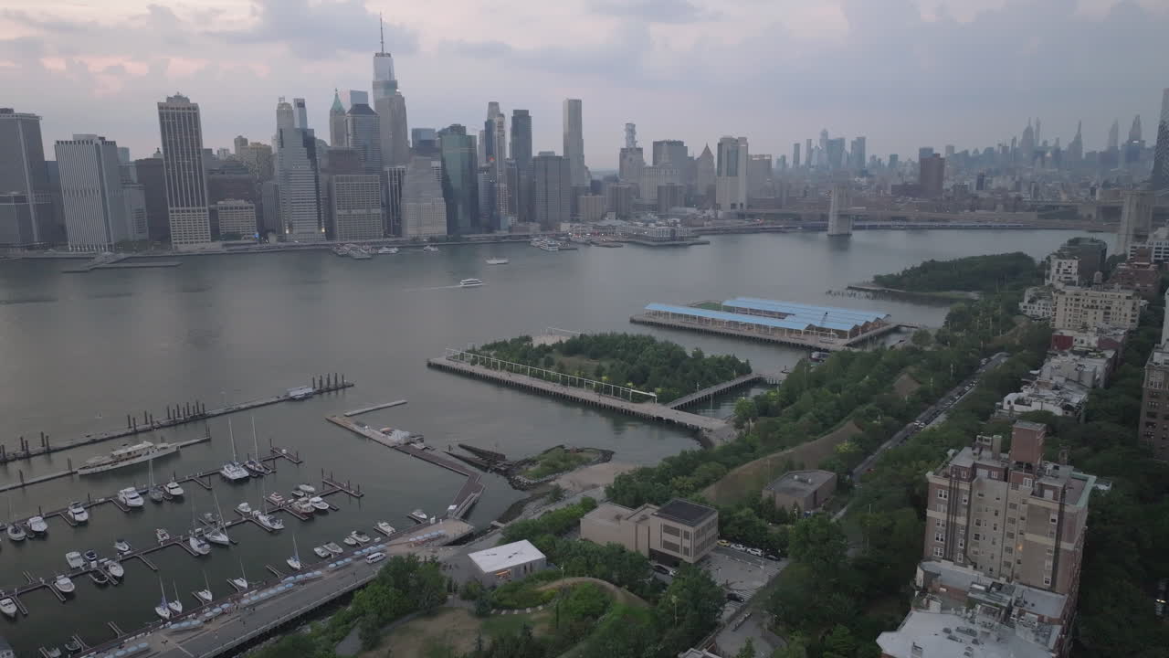 Aerial view of Brooklyn, Manhattan, and The East River on an overcast day. Shot in New York City