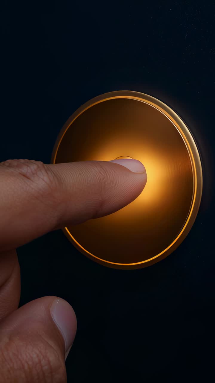 Vertical video: Finger nearing pressing releasing amber button on dark panel inner ring staying lit