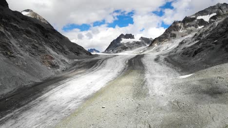 Flyover-over-Otemma-glacier-in-Valais,-Switzerland-on-a-cloudy-day