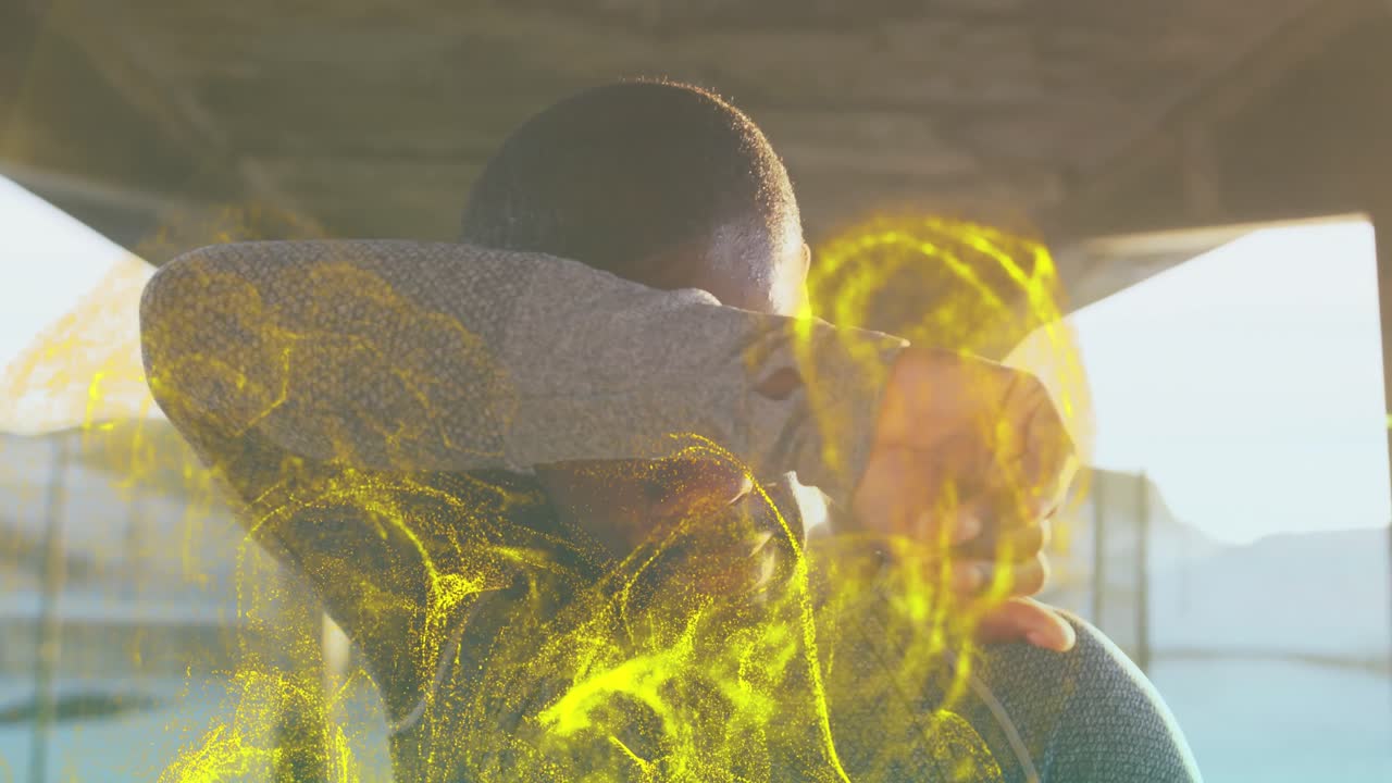 золотая цифровая волна против усталого афроамериканца, который делает перерыв от бега на открытом воздухе.