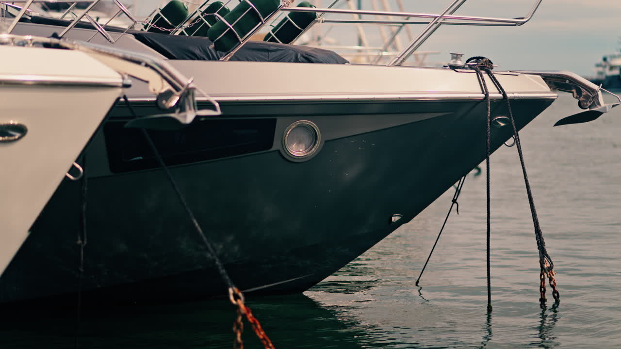 Close up of a white boat docked in the harbour of Golfe-Juan, France