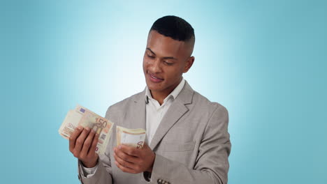business man, happy and counting cash in studio