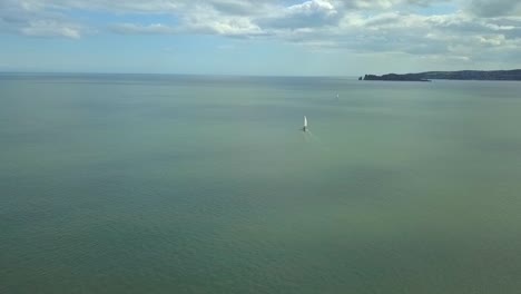 Aerial-view,-4k-panning-shots-of-a-boat-along-the-coastline