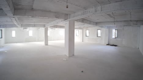 walking inside on the open space floor under construction