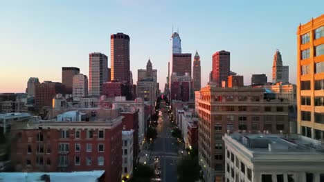 a breathtaking transformation: day to night over a city skyline with illuminated buildings and streets leading to a towering landmark