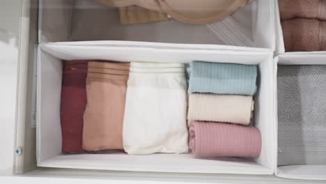 organized underwear, socks, and towels in a drawer