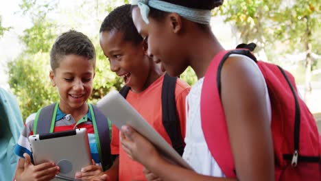group of school kids using digital tablet