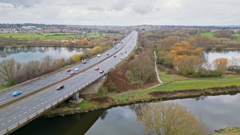 aerial drone cinematic video footage of the m1 motorway near the city of wakefield, west yorkshire, uk