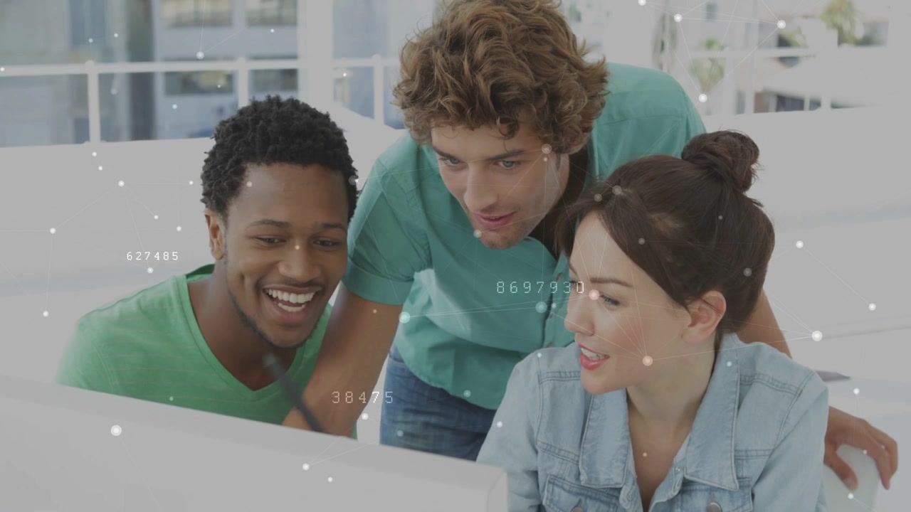 Three coworkers leaning over white monitor, man pointing pen starting data review and smiling