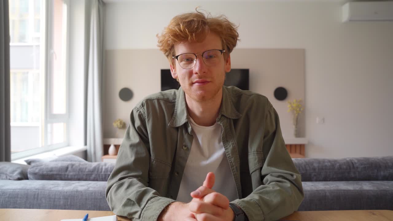 Young british man studying online or having business video conference on laptop