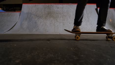 Man-practicing-skateboarding-in-skateboard-arena-4k