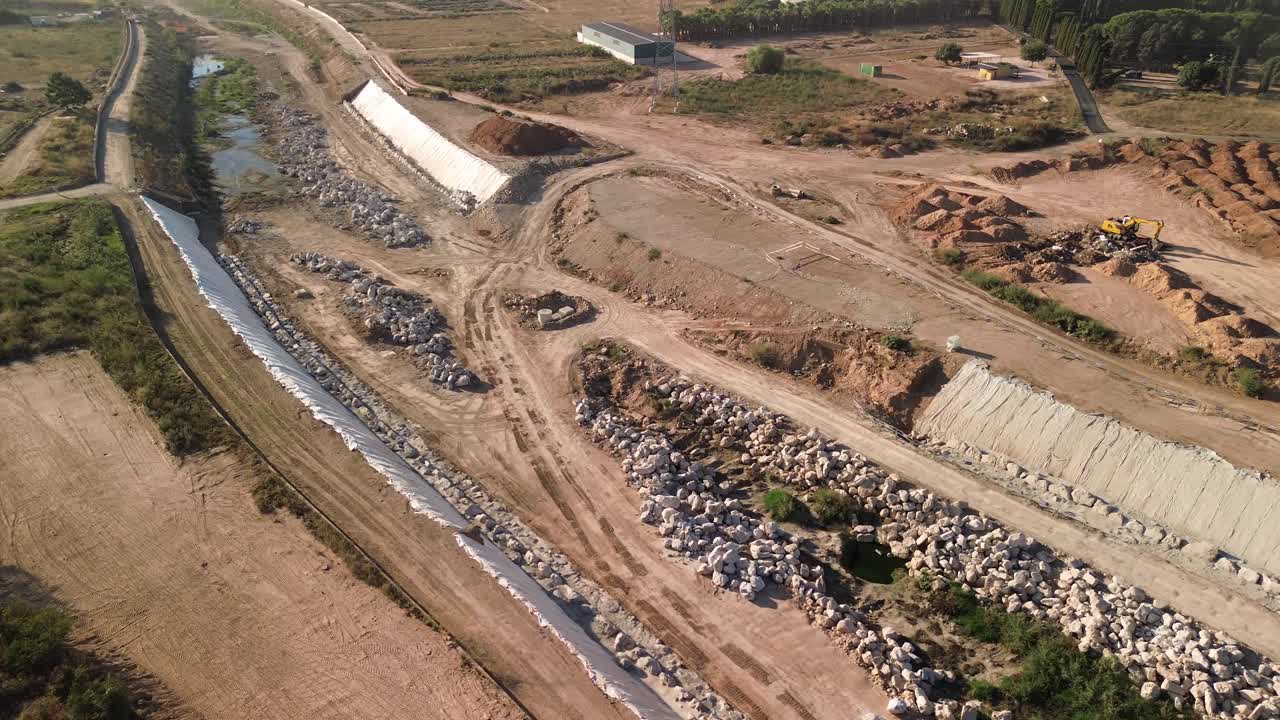 Drone view of public works and riverbed engineering at Barranco del Poyo, Paiporta, Valencia, Spain, focused on flood prevention after the 2024 DANA disaster