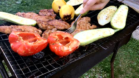 human hands prepares a pickled tasty pork or beef meat and vegetables.