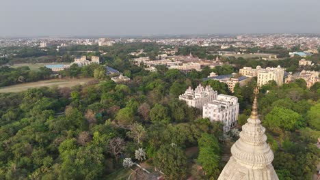 aerial perspective of varanasi's dense urban sprawl, with temples reflecting the timeless connection