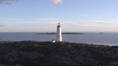 aerial view of lille torungen lighthouse in the municipality of arendal in agder county, norway - drone shot