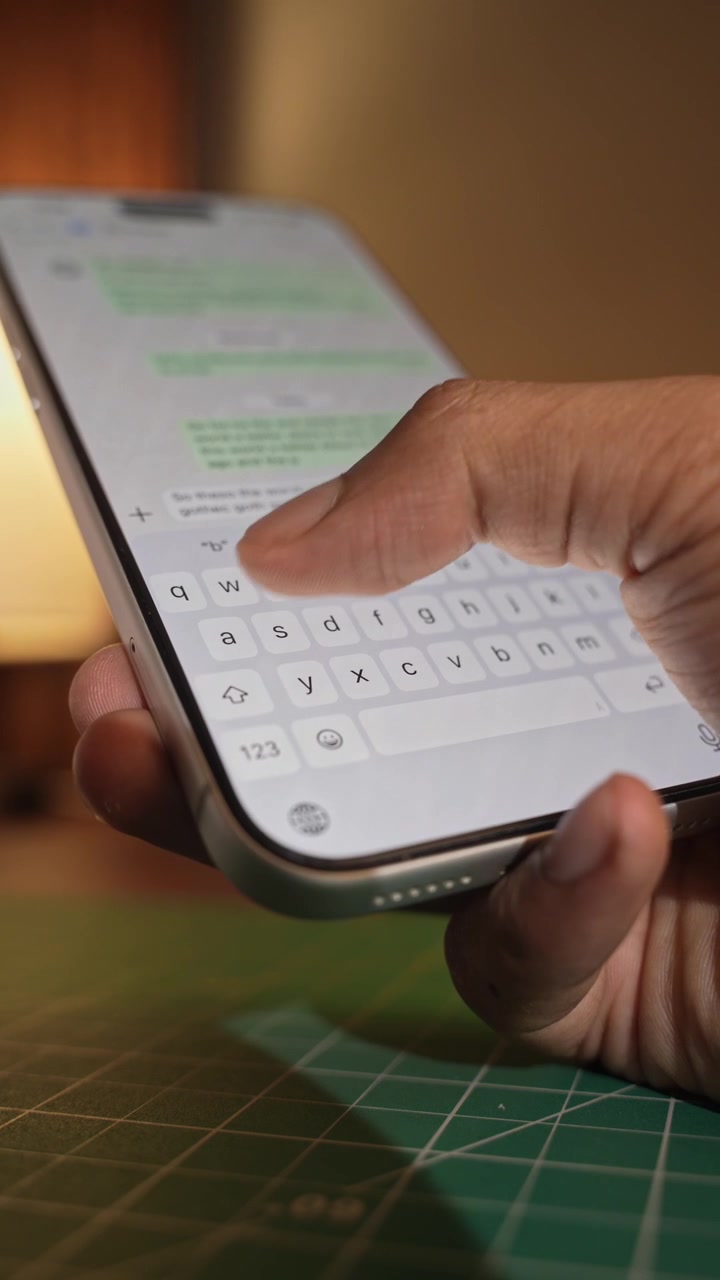 Man hands chatting and typing on smartphone macro closeup. Unrecognizable human typing text message tapping touchscreen keyboard using whatsapp application a social media.