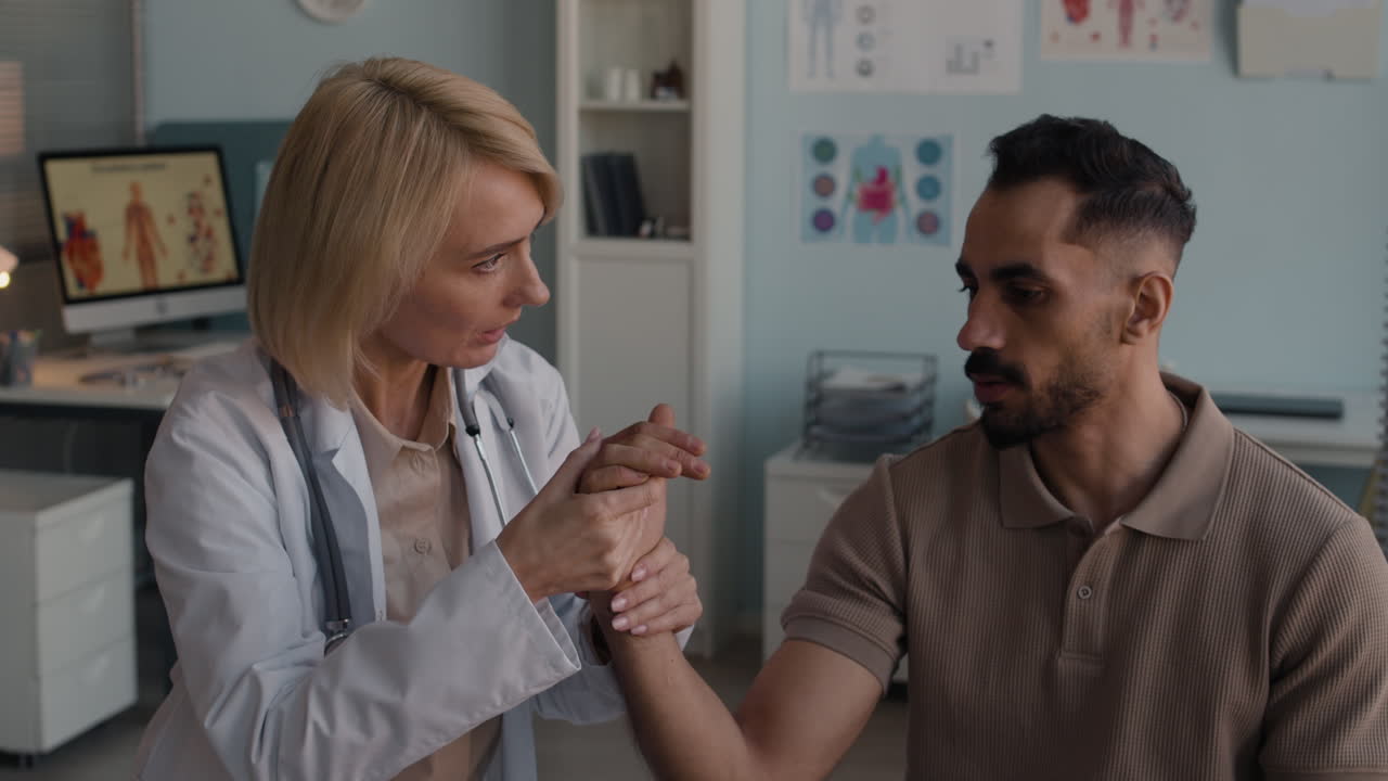Doctor examining patient's wrist